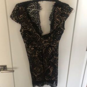 Black lace dress. Good condition. Skin tone under layer.
